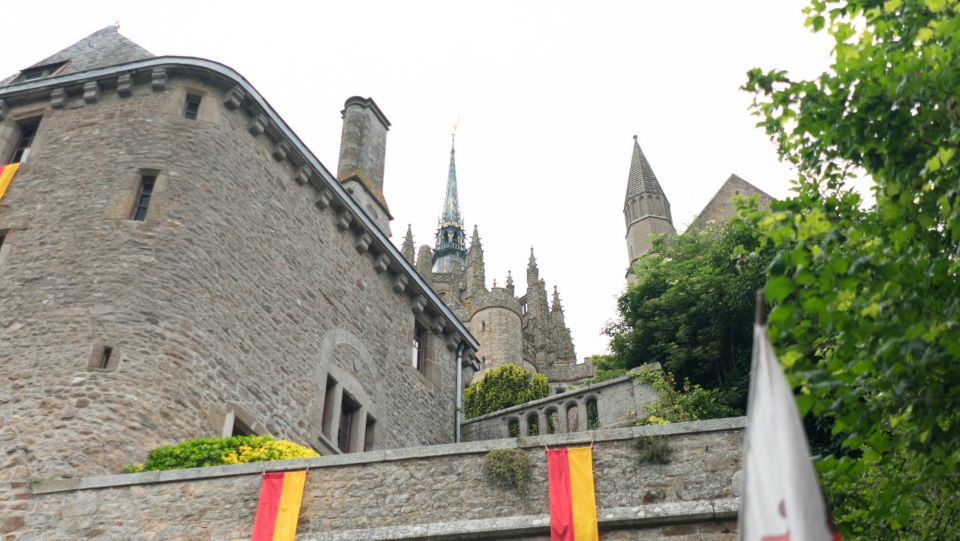 From Paris: Small-Group Mont St Michel Tour & Cider Tasting - Entering the fortified village: free time on steep medieval streets
