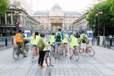 Paris Evening Snapshot Bike Tour - Riding past the Louvre and Notre-Dame after dark