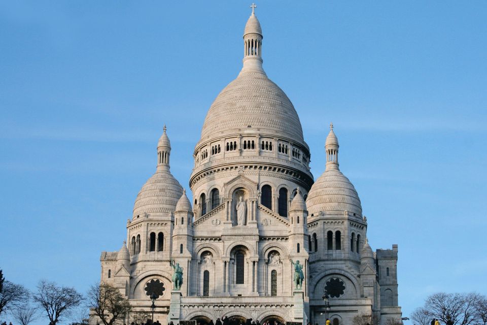 Paris: Montmartre Small Group Guided Walking Tour - Dalida statue, Le Bateau-Lavoir, and Abbesses stops